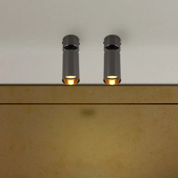 Rotatable GU10 surface-mounted spotlight illuminating a modern kitchen with sleek decor, adding style and functionality to the space.172-030282